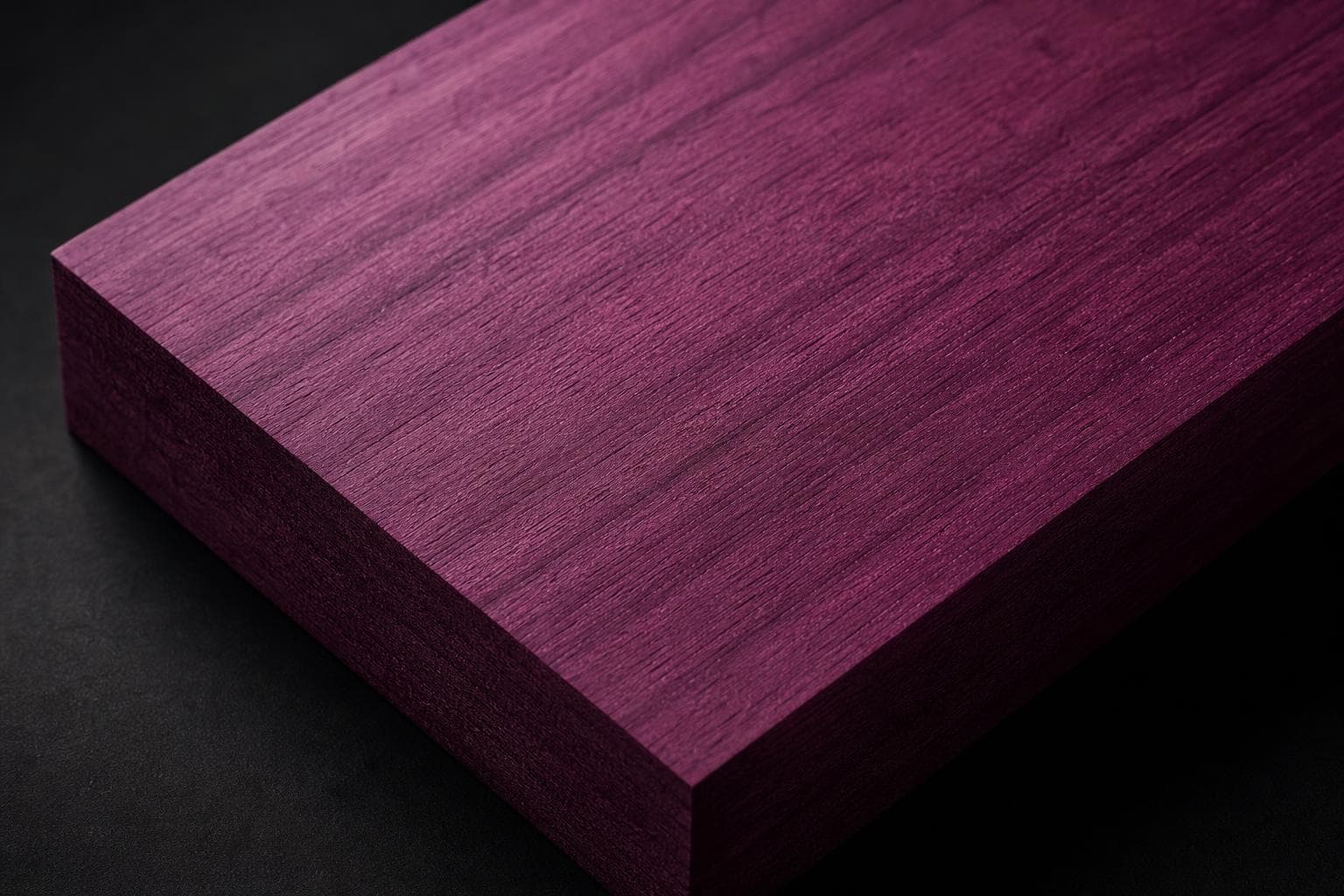 Purpleheart board, close-up of its purple face and edge